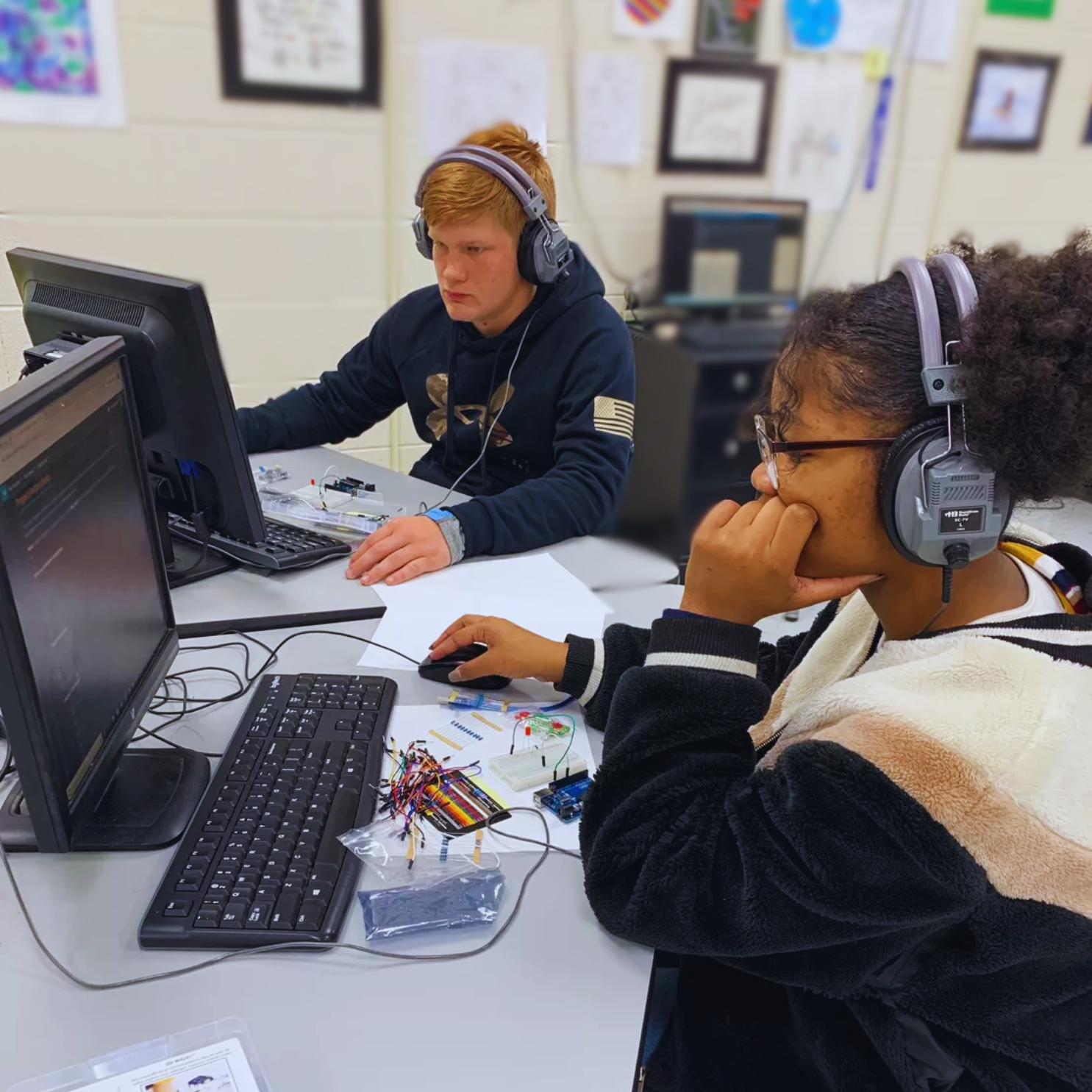 Middle school students engaging with Compass STEM curriculum activities that connect science and technology to real-world applications.